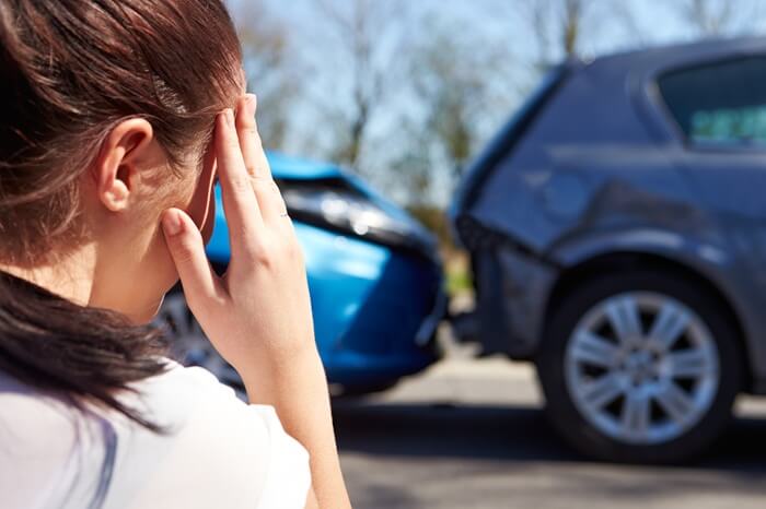 Auto accident chiropractor in Centennial CO reviewing car crash injury x-rays with a patient at Axis Health and Wellness