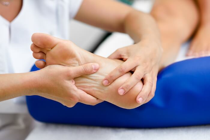 Neuropathy treatment evaluation of the feet with Dr. Tony Nicholas at Axis Health and Wellness in Centennial CO