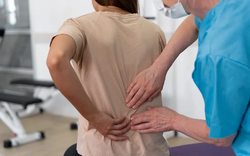 Woman being treated for a herniated disc at a chiropractic office in Centennial CO